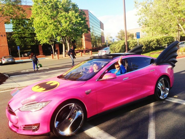 Sergey Brin in Google Glass driving a pink Tesla dressed like a batmobile at LinkedIn HQ