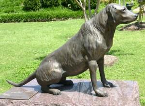 pooping dog statue