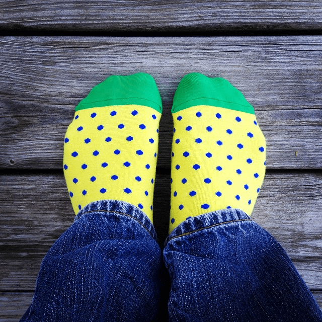 yellow socks with blue polkadots and green toes