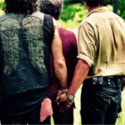 Daryl and Rick holding butts 2