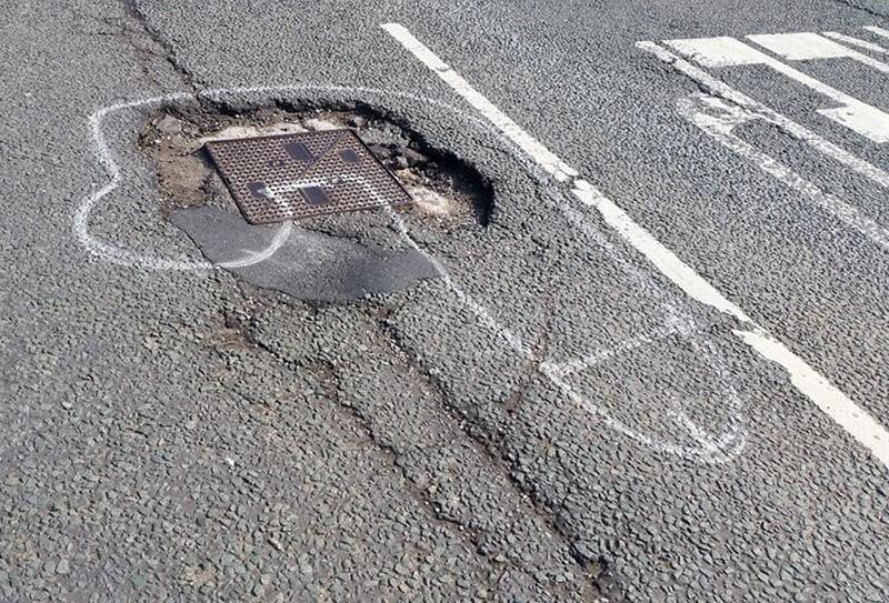 Painting penises around potholes 2