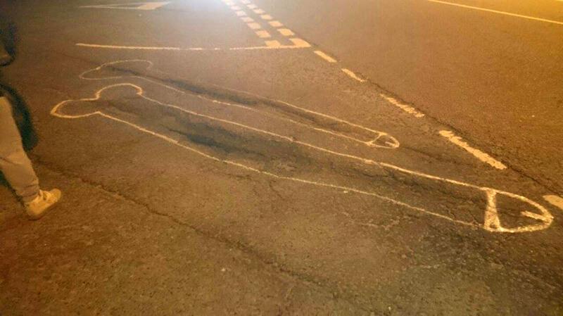 Painting penises around potholes 3