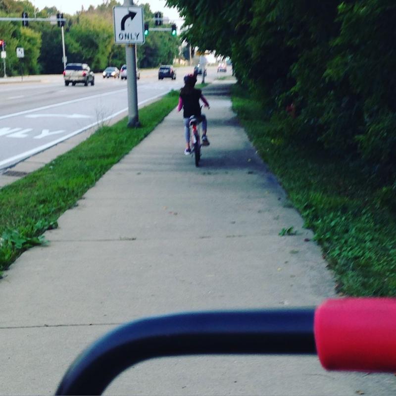 M riding her bike