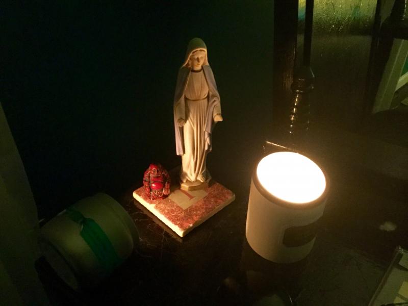 Buddha and Mary by candlelight