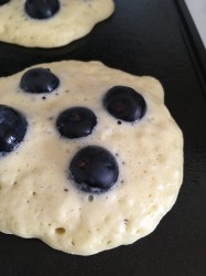 Blueberry pancakes grilling