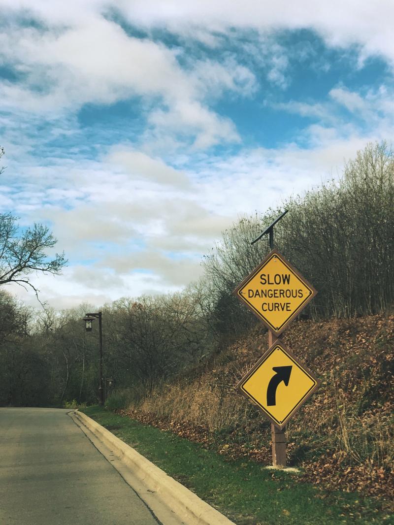 Slow dangerous curve sign