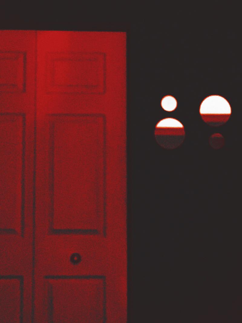 Creepy red door and circular mirrors