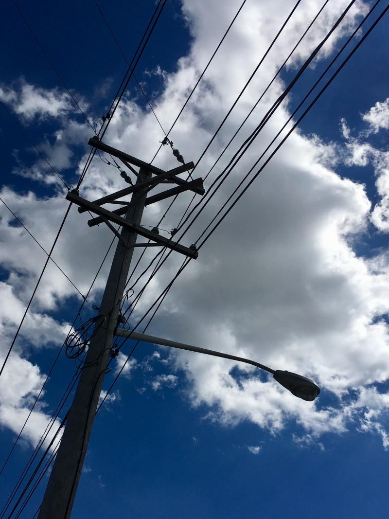 Telephone poles against blue skies 3