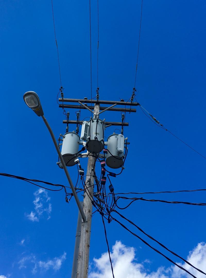 Telephone poles against blue skies 4