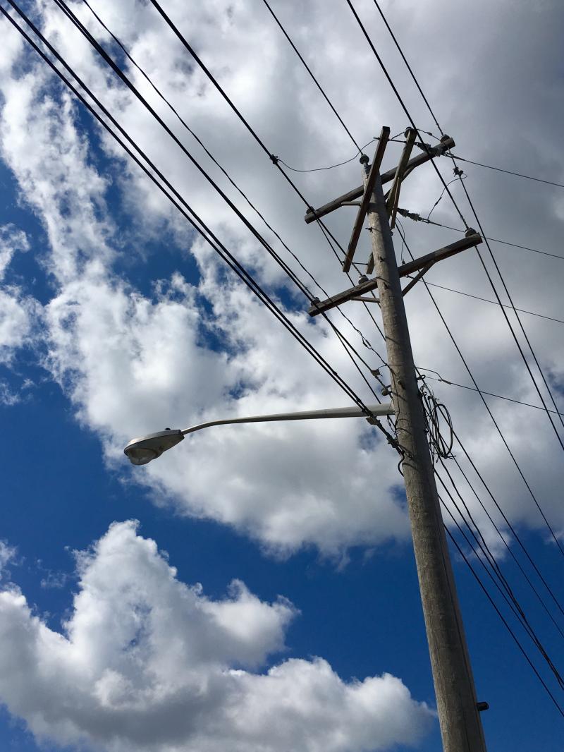 Telephone poles against blue skies 5