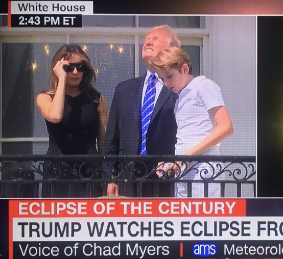 Trump watches eclipse