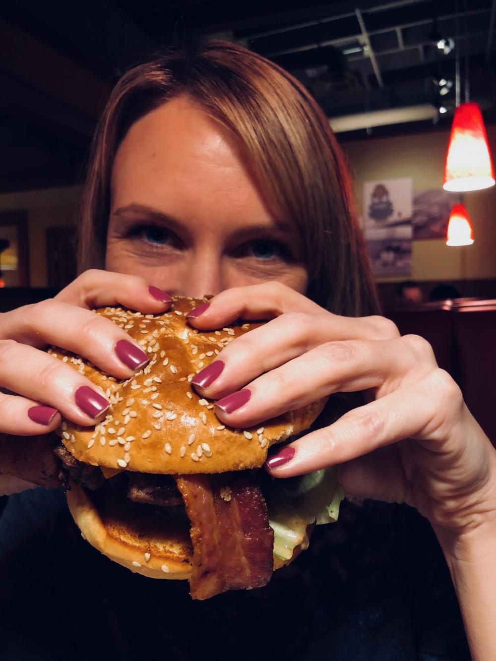 Sara with burger at Denny's