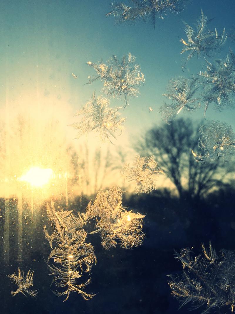 Sunrise with frost on the window 1