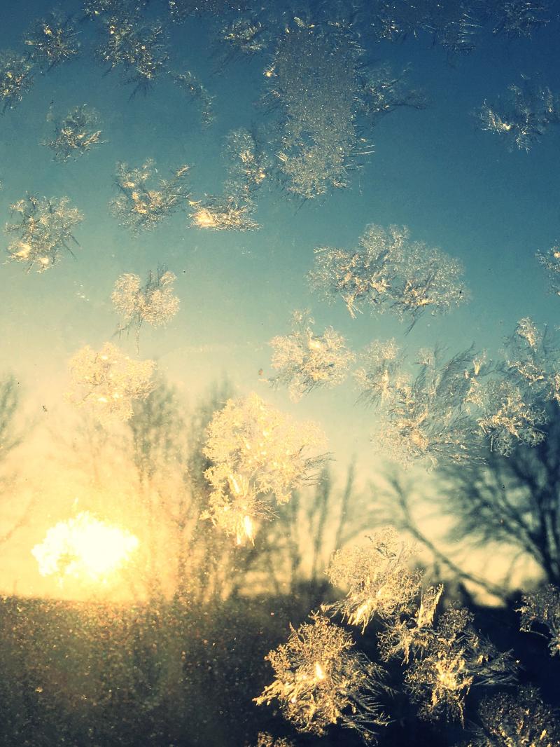 Sunrise with frost on the window 2