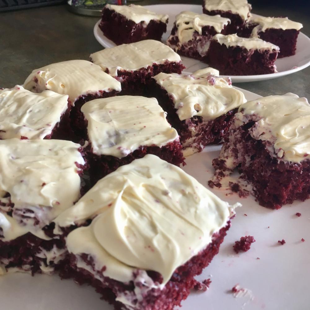 Red velvet cake cut and frosted