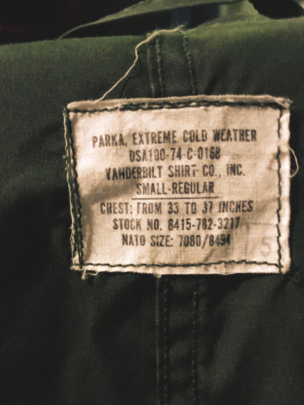 Green army trench coat tag