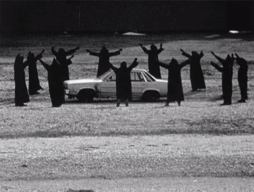 Pagans surrounding a car