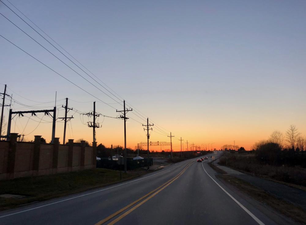 Highway sunset with telephone poles