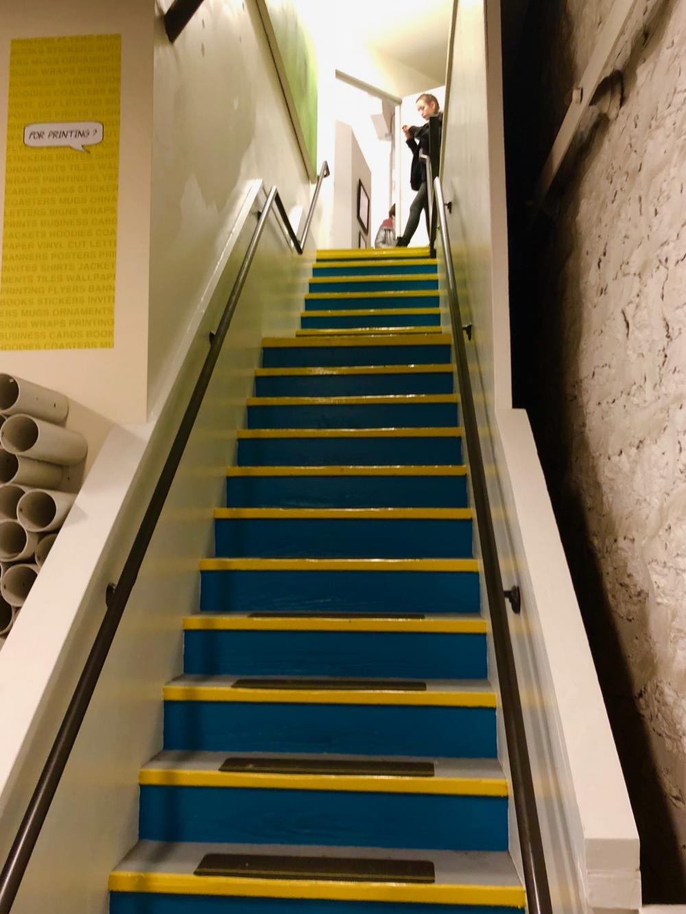 Maggie at the top of the staircase