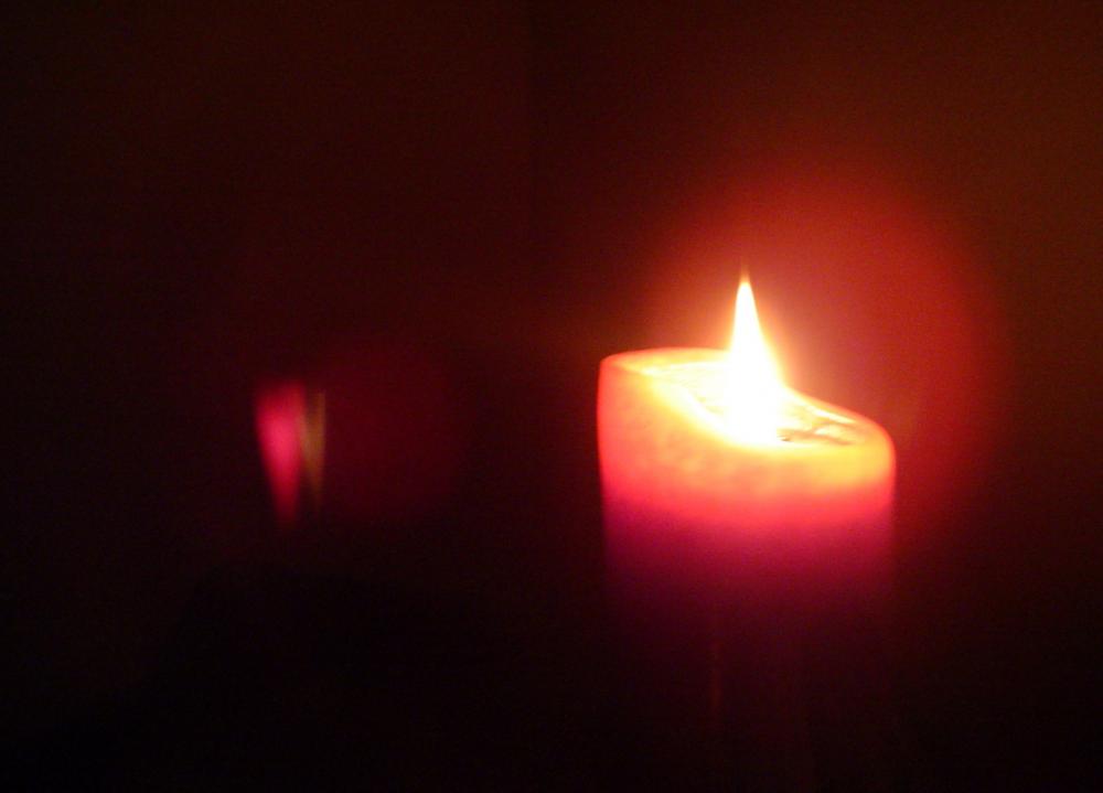 Red candle in the dark