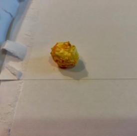 Cheese less popcorn on envelope