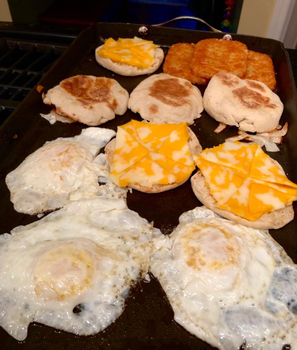 3 eggs and 3 hashbrowns and 3 english muffins with cheese