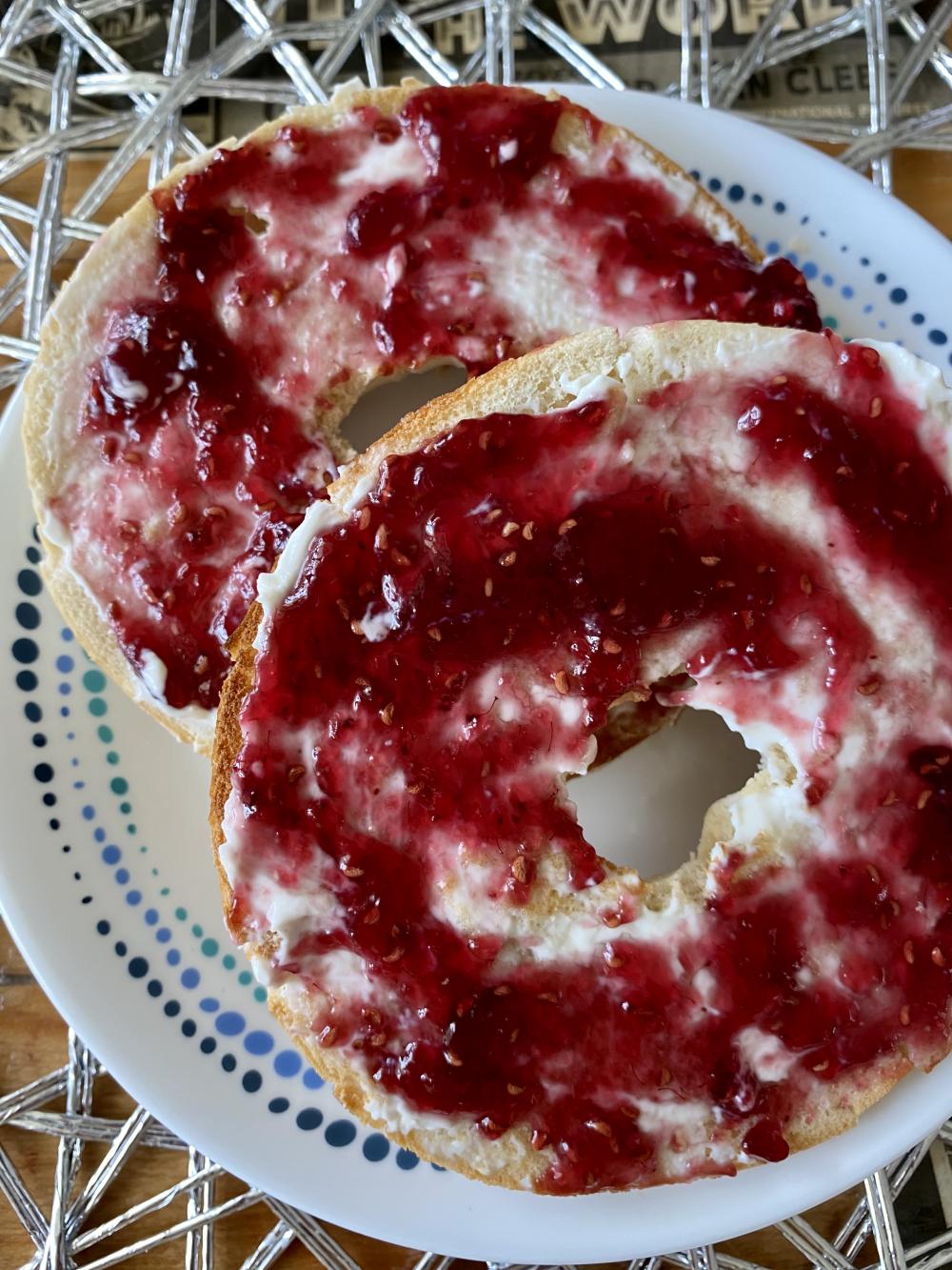 Bagel cream cheese and raspberry jam