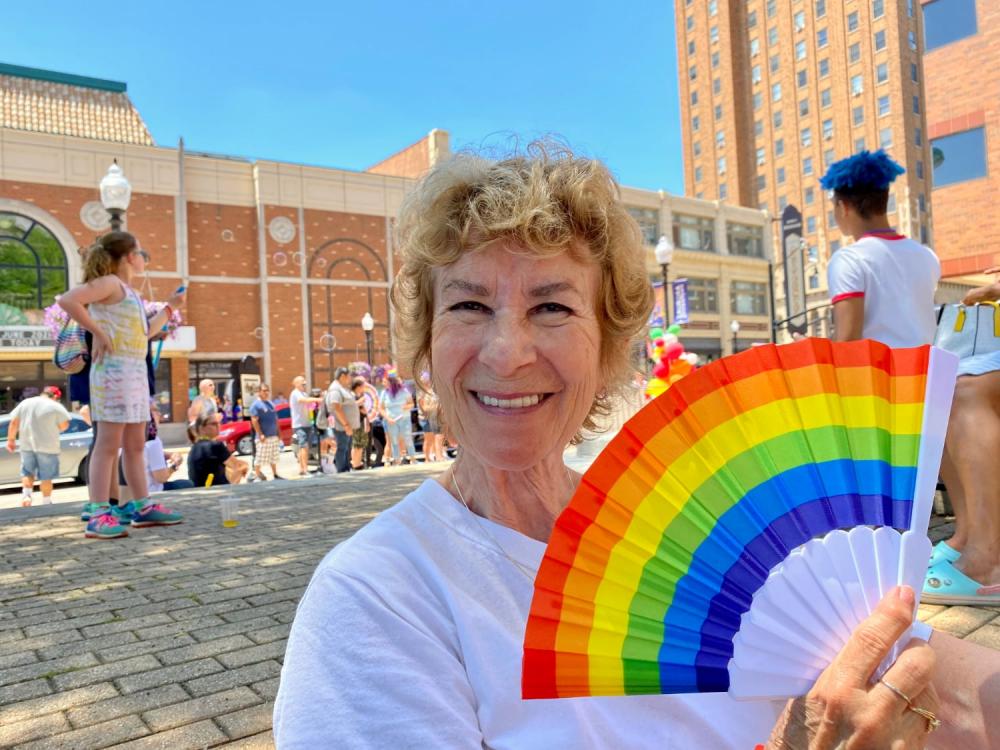 Momma J with a rainbow flag