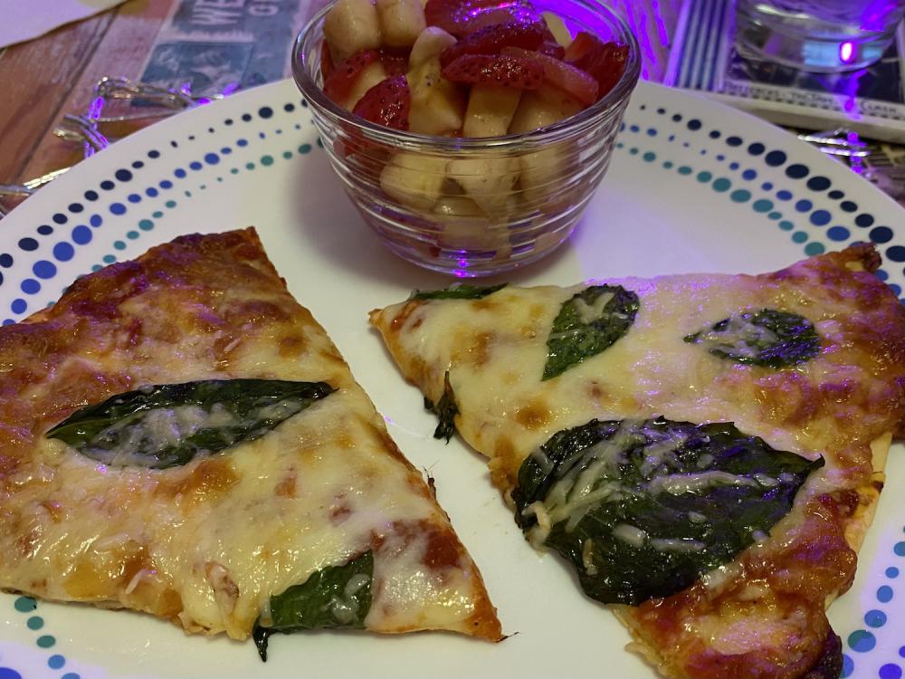 a frozen pizza with fresh basil and parmesan 2