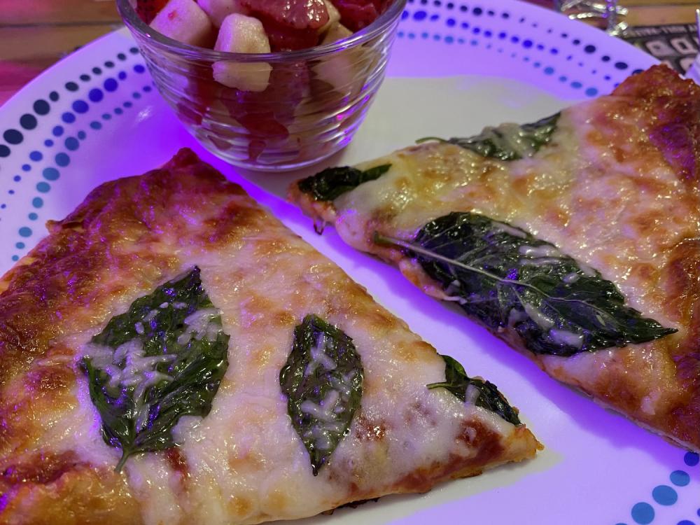 a frozen pizza with fresh basil and parmesan 3